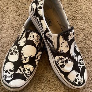 Black and white skull slip on vans